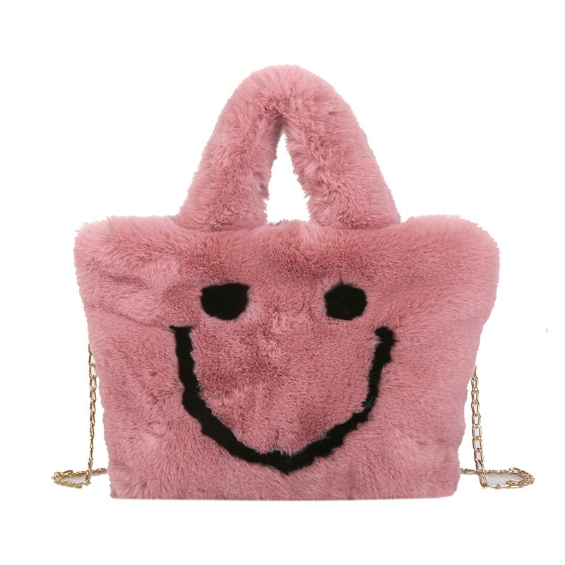 Women aplush smiley handbag