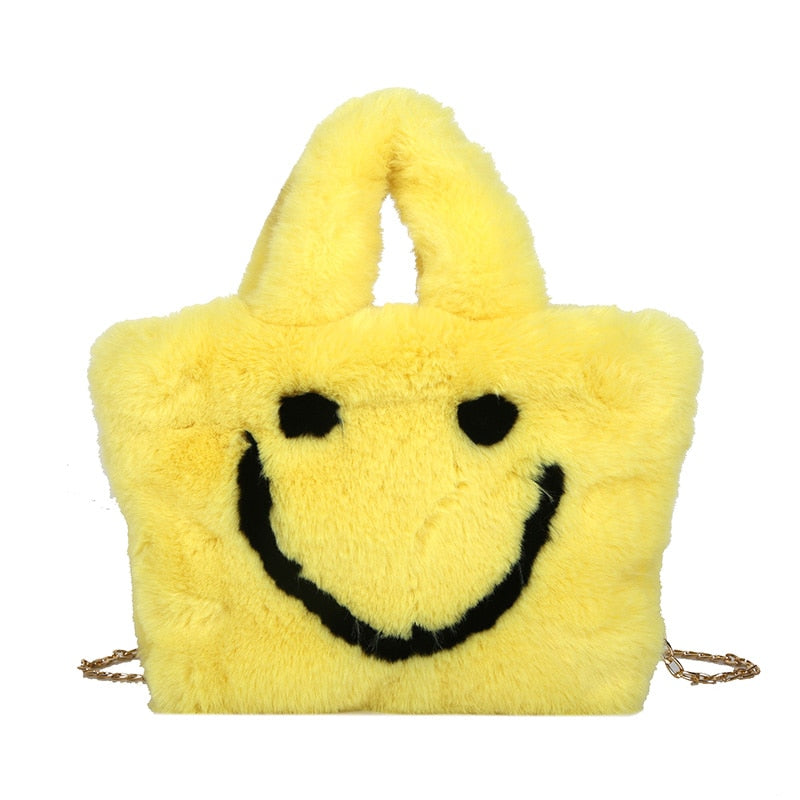 Women aplush smiley handbag