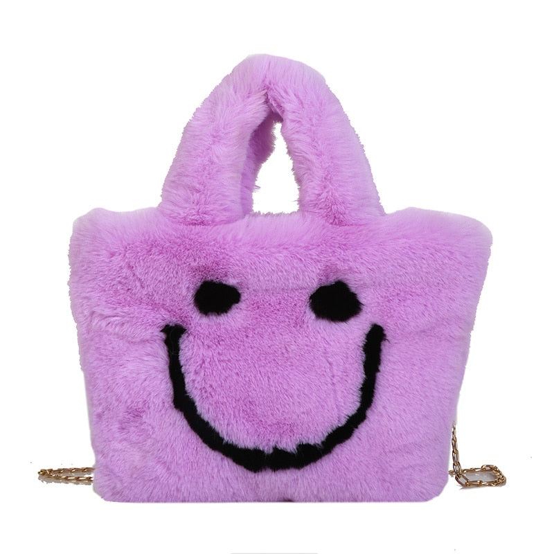 Women aplush smiley handbag