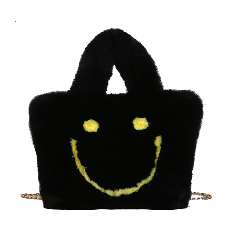 Women aplush smiley handbag